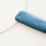 Modern minimalist necklace: peacock with dots