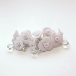 Bridal earrings: cluster earrings with white glittered roses and Swarovski crystals